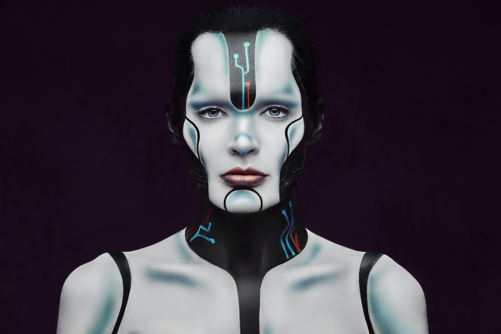 Sensual cyber woman. Technology and future concept. Isolated on a dark textured background.